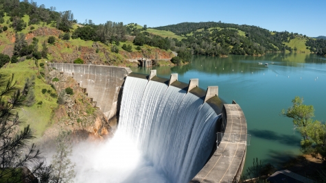 Water spills over the top of Englebright Dam on the Yuba River. 